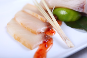Raw white fish with sauce