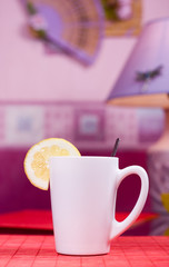 white cup on the table