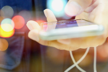 communication technology concept, close up image of people using smart phone, Multiple exposure of smart phone and Bokeh