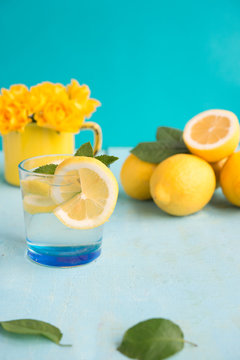 Cold refreshing lemonade with lemons and a thyme

