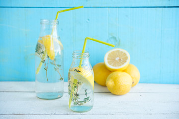 Cold refreshing lemonade with lemons and a thyme
