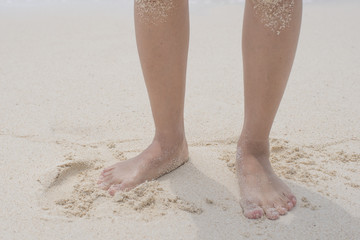 Men legs, walking on the beach