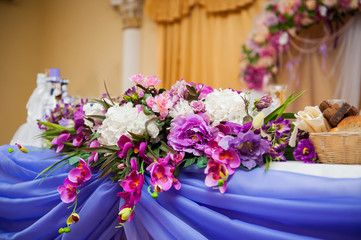decor of flowers on a table bride and groom