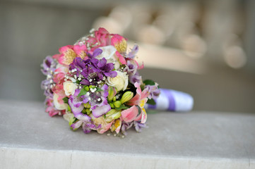 Close up beautiful wedding bouquet on bright background
