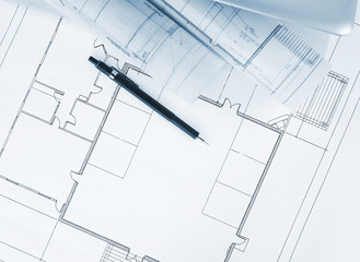 Blueprints and laptop