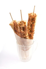 bread on skewers in glass