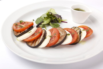 Italian appetizer with mozzarella and tomatoes