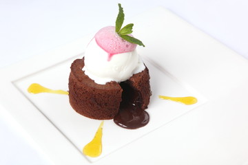 chocolate fondant with sauce and mint