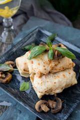 Nourishing pancakes with a stuffing, mushrooms and chicken
