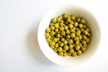 canned peas on white background