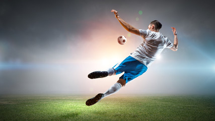 Soccer player hitting ball