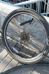 A man pumps bicycle wheel