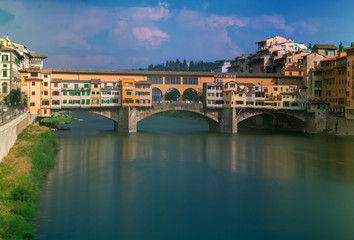 Fototapeta na wymiar A view of the Old Bridge Ponte Vecchio over Arno river in Florence, Italy