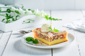 Tasty apple pie and ice cream with mint leaves