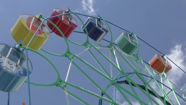 Ferris wheel in the summer Park