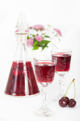 Cherry liqueur in crystal glasses, vertical