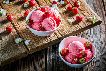 Homemade ice cream with strawberries and mint leaves