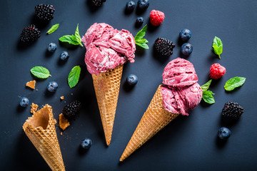 Homemade berry fruits ice cream in waffels © shaiith