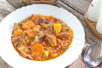Pork meat stew with vegetables in plate
