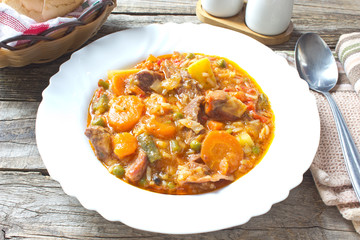 Pork meat stew with vegetables in plate