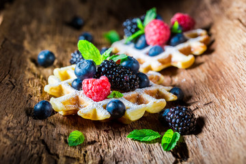 Homemade waffels with berry fruits in waffels