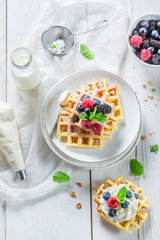 Fresh berries with waffels and whipped cream