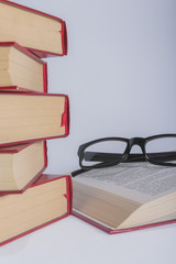 books with reading glasses