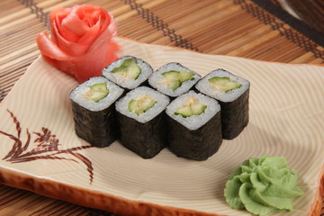 Japanese roll with wasabi sauce on plate