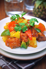 sweet and sour pork. deep fried crispy pork stir fried with pineapple and fresh capsicum, in sour and sweet sauce. worldwide famous sweet and sour pork. chinese cuisine