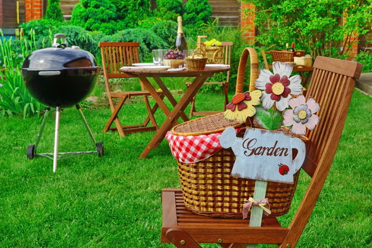 Close-up Of Chair With Hamper And Sign Garden, Party Scene