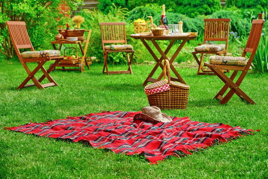 Picnic Blanket With Hat And Basket. Party Or Picnic Concept