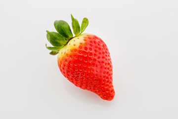 Closeup of not fully ripe strawberry