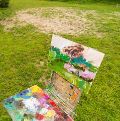 Artist's sketchbook and palette in a park