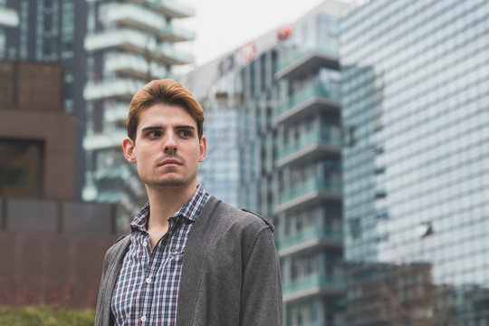 Young man posing in the city streets