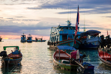 Fototapeta premium Fishing and transport boat on Koh Tao beach warm light sunset ti