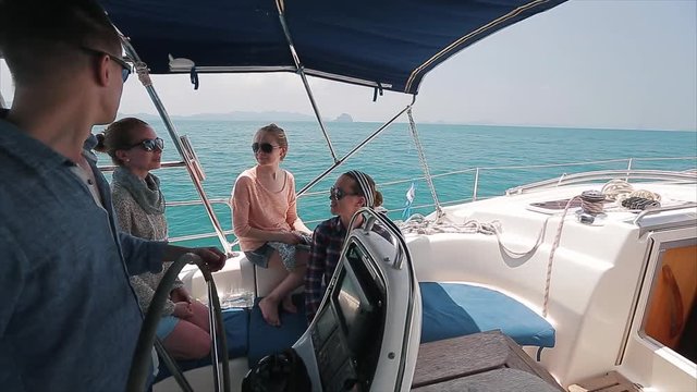 Crew on the yacht in the blue sea