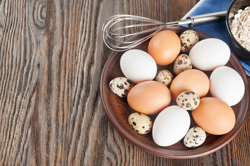 Quail and chicken eggs in a clay plate