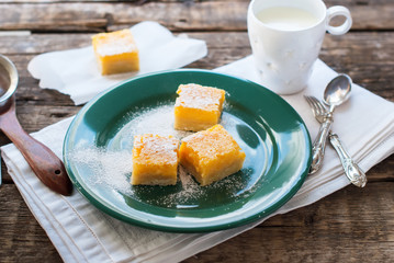Baked Lemon Bars Powdered Sugar Wooden Table