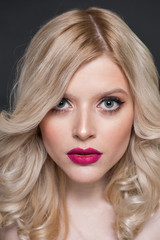 Unretouched studio beauty portrait of a blonde girl