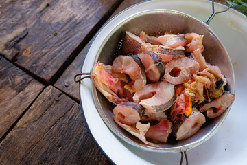 countryside lifestyle - prepare of Fresh uncooked cut fish on sieve, raw ingredient fish from countryside, cooking by local people