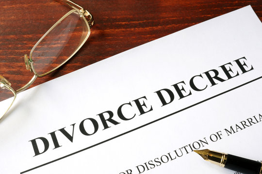 Divorce decree form on a wooden background