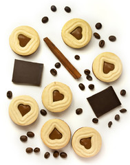 Pieces of chocolate, cocoa cookies, coffee beans and cinnamon stick