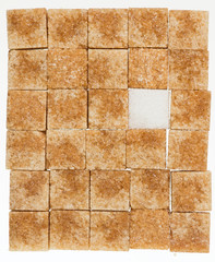 Cubes of sugar cane brown and white refined isolated