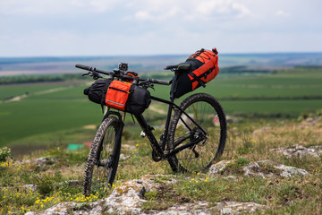 Bicycle with orange bags for travel