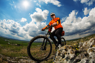 Naklejka premium Young man is riding bicycle outside. Healthy Lifestyle.