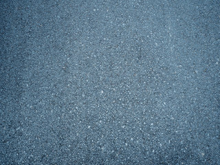 dark and rough asphalt surface in the road