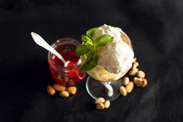 ice cream and nuts on black background