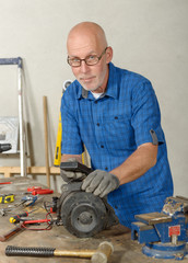  man with antique generator for the car