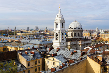 Naklejka premium Catherine's church towers over the rooftops of St Petersburg.