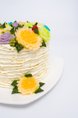 cake with flowers on white
